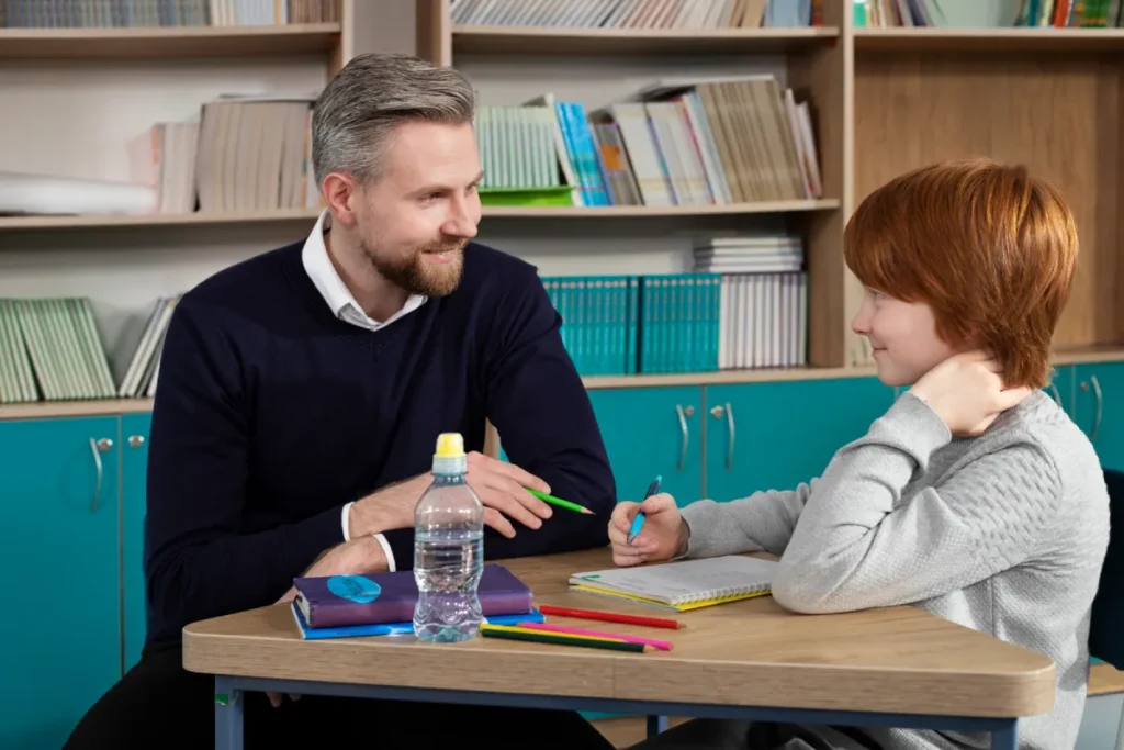 Father helping son with schoolwork during child support parenting time