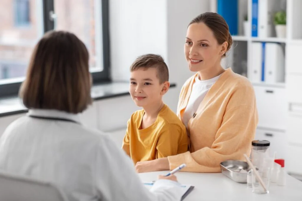 Child support attorney meeting with mother and son in office