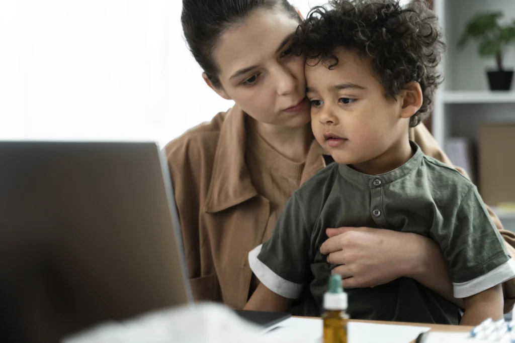 Mother and child reviewing information online about child support