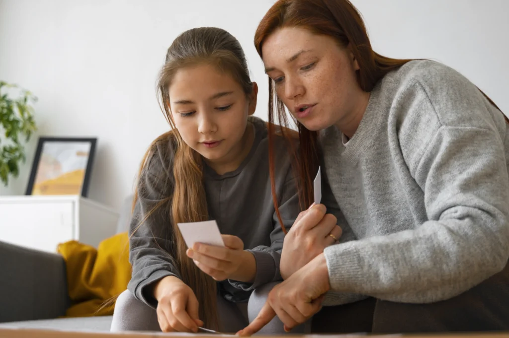 Mother and daughter reviewing child support paperwork at home