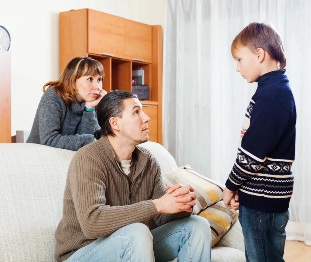 Parents discussing child support matters with son at home